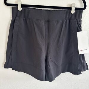 NWT Lululemon black stretch woven relaxed fit 4 inch short